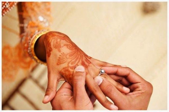 Couple exchanging rings