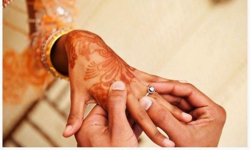 Couple exchanging rings