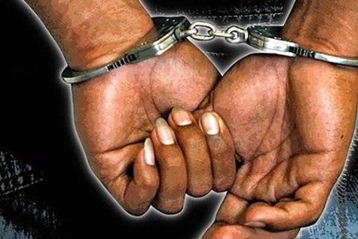 A criminal in handcuffs