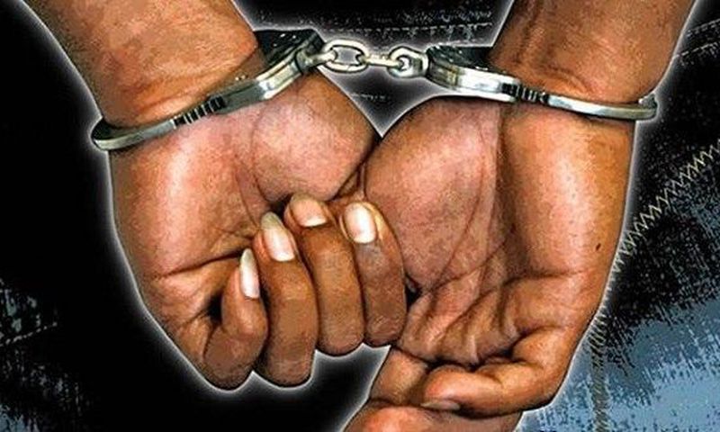A criminal in handcuffs
