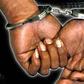 A criminal in handcuffs