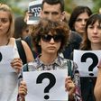 People carry signs during a march in central Kiev on July 20, 2017 to commemorate the death of investigative journalist Pavel Sheremet