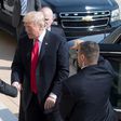 US President Donald Trump (C) marked the six-month point of his president with a visit to the Pentagon, shaking hands with his Defense Secretary James Mattis (L)