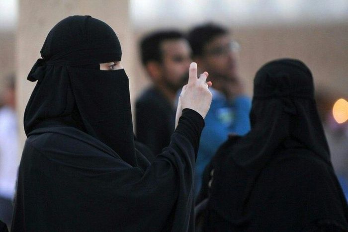Women in Saudi Arabia are required to wear long black abaya robes and cover their hair in public