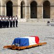 French President Emmanuel Macron pays his respects to the flag-draped coffin of Holocaust survivor Simone Veil, during a tribute ceremony at the Invalides in Paris, on July 5, 2017