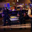 Police guard a street in the Finsbury Park area of north London where a vehicle hit pedestrians on June 19, 2017
