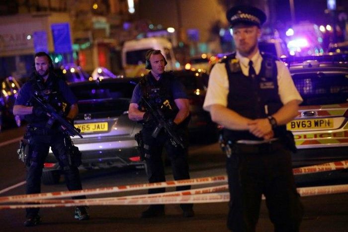 Police guard a street in the Finsbury Park area of north London where a vehicle hit pedestrians on June 19, 2017