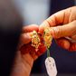 Customers buy gold earrings at a jewelry shop in Kuala Lumpur, April 17, 2013.