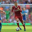 Liverpool's Roberto Firmino runs with the ball during their match against Arsenal in Liverpool, north west England on August 27