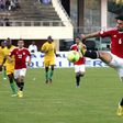 Egypt's Hegazi Ahmed (R) controls the ball during a 2014 World Cup qualifying football match against Zimbabwe on June 9, 2013