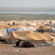 Displaced Syrians are seen on August 13, 2017 at a desert camp in Hasakeh province dominated by young men fleeing Islamic State group conscription
