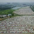 New cars are seen in a parking lot of the Brilliance factory in Shenyang, in China's northeast Liaoning province on July 17, 2017