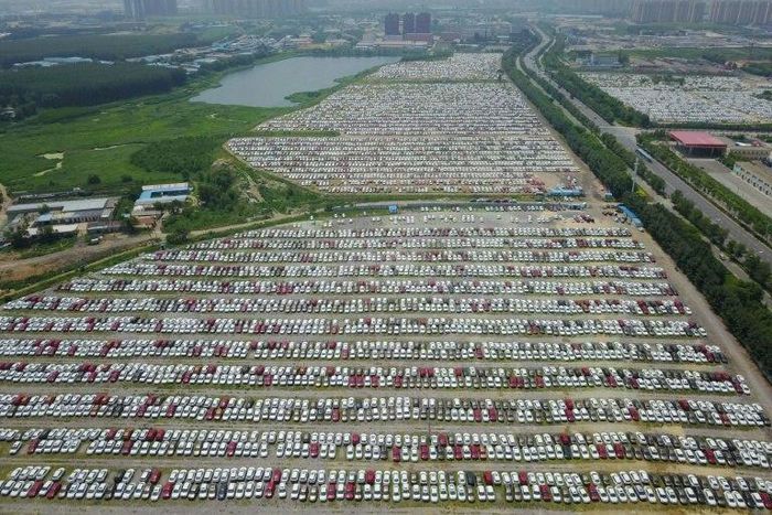 New cars are seen in a parking lot of the Brilliance factory in Shenyang, in China's northeast Liaoning province on July 17, 2017