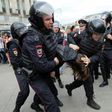 Russian police officers detain participants of an unauthorized opposition rally in Tverskaya street in central Moscow on June 12, 2017
