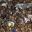 Fans of Paraguay's Cerro Porteno cheer for their team during their Copa Libertadores 2016 football match against Colombia's Independiente de Santa Fe at Defensores del Chaco stadium in Asuncion, on April, 20, 2016
