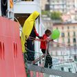 A girl disembarks from the Aquarius rescue ship run by NGO S.O.S. Mediterranee and Medecins Sans Frontieres in the Italian port of Salerno on May 26 2017 after a rescue operation in the Mediterranean