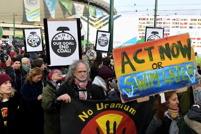 Protesters call for action on climate change on the sidelines of the conference in Poland which was intended to breathe life back into the Paris Agreement