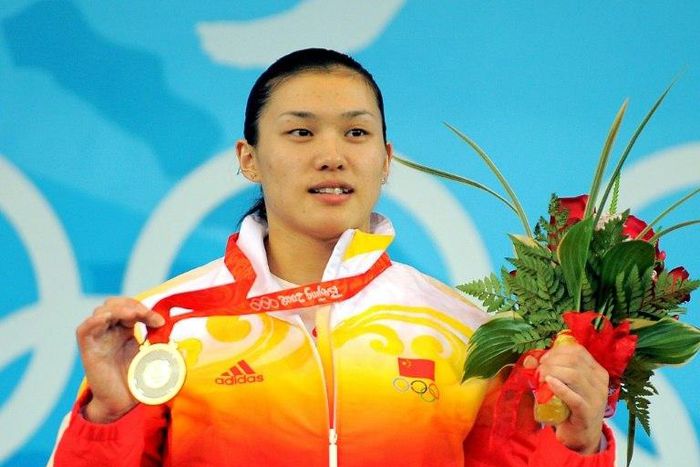 Gold medalist Cao Lei of China poses during the medal ceremony for the women's 75 kg weightlifting event during the 2008 Beijing Olympic Games on August 15, 2008