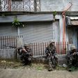 Philippine troops take positions during an operation to flush out Islamist militant snipers in Marawi, on the southern island of Mindanao