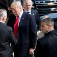 US President Donald Trump (C) shakes hands with US Defense Secretary James Mattis (L) as he arrives at the Pentagon in Washington for a strategy session on defeating IS