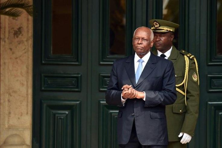 Angola's President Jose Eduardo Dos Santos waits for the arrival of his French counterpart at the presidential palace in Luanda in July 2015