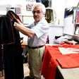 Italian tailor Raniero Mancinelli, 80, works on a cardinal robe at his workshop near the Vatican City