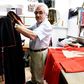 Italian tailor Raniero Mancinelli, 80, works on a cardinal robe at his workshop near the Vatican City