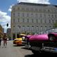Cubans walk near the Manzana Kempinski Hotel, the first ultra luxury hotel in Cuba, on May 22, 2017
