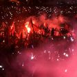 People wave Turkish national flags as Turkish President adresses a speech on July 15, 2017 during the first anniversary of failed coup in Istanbul