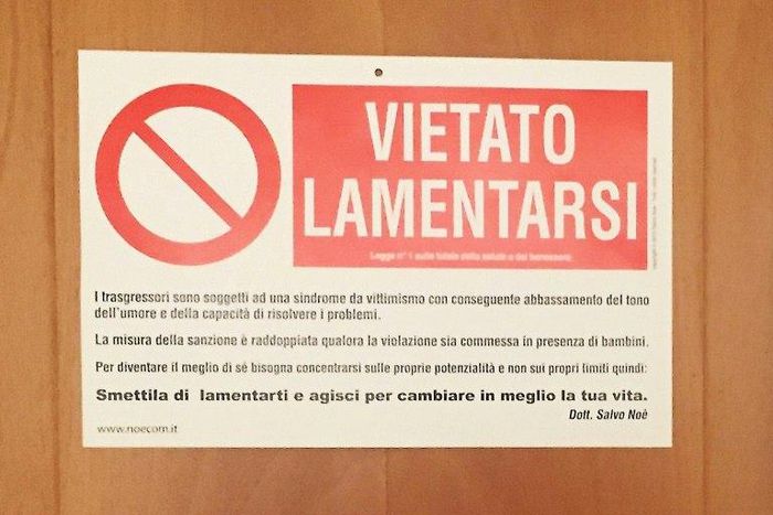 A sign on the door of Pope Francis's private apartment at the Vatican reads "No Complaining"