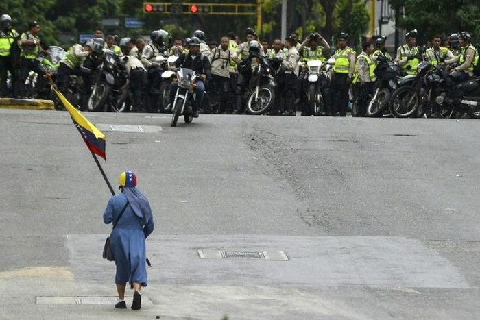 Venezuelan security forces are accused of running over, attacking and robbing protesters and journalists