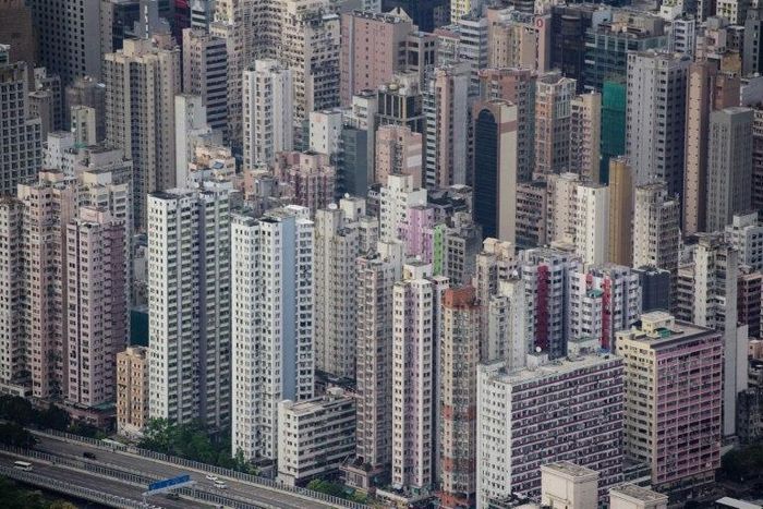 Sky-high prices and the cost of living outstrip many ordinary residents' salaries in Hong Kong, with apartments becoming increasingly cramped and generations of families forced to share