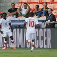 Alphonso Davies (L) of Canada celebrates after scoring against Costa Rica in the first half, at BBVA Compass Stadium in Houston, Texas, on July 11, 2017