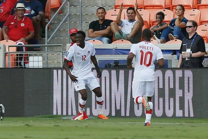 Alphonso Davies (L) of Canada celebrates after scoring against Costa Rica in the first half, at BBVA Compass Stadium in Houston, Texas, on July 11, 2017