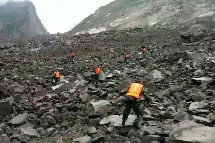 Some 40 homes in the village of Xinmo were swallowed by huge boulders after the side of a mountain collapsed, blocking a two kilometre (one mile) stretch of river