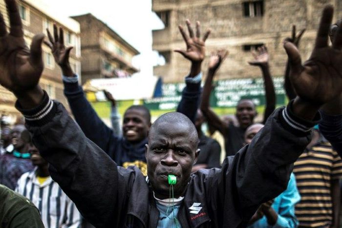Opposition supporters march through Nairobi's Mathare slum, shouting 'Uhuru must go'
