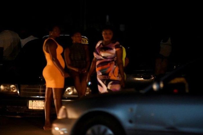 Prostitutes stand on the street in Benin City, Nigeria's capital for illegal migration. International Organization for Migration has recorded an explosion in the number of Nigerian women trafficked into Europe