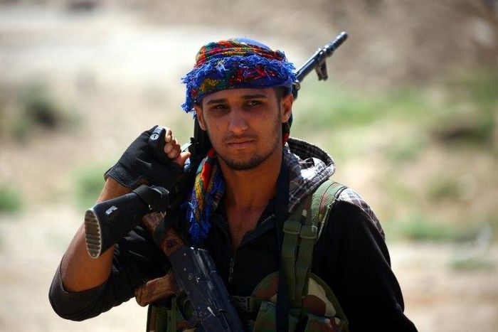A Syrian Democratic Forces fighter in the Islamic State group's Syrian bastion of Raqa after seizing the Al-Romaniya area on June 11, 2017