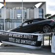 'Do you want this car? Kill dictatorship!' asks the slogan on the art installation outside Merkel's office, along with pictures of Erdogan, Putin, and King Salman