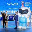 Vivo Senior Vice President Ni Xudong and FIFA Secretary General Fatma Samouraon hold a framed football jersey during an event on Beijing on May 31, 2017, to announce Vivo's sponsorship of the FIFA Football World Cup