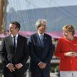 Italy's Prime Minister Paolo Gentiloni (C) met with German Chancellor Angela Merkel (R) and French President Emmanuel Macron (L) in Trieste before an annual Western Balkans summit
