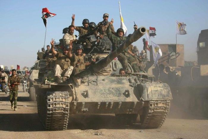 Iraqi government forces and Abbas Brigade fighters of the Hashed al-Shaabi paramilitary group advance towards the city of Tal Afar, the main remaining bastion of the Islamic State group in the country's north