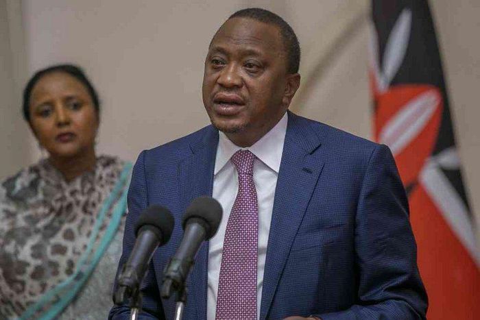 President Uhuru Kenyatta giving a speech with CS Amina Mohammed