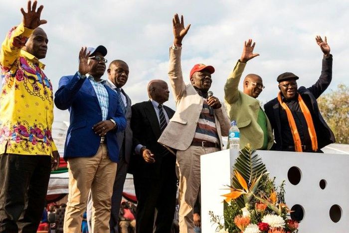 Zimbabwe's opposition joined forces on Saturday in a bid to unseat Robert Mugabe from power next year