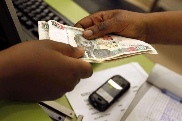 A customer hands over money to a vendor