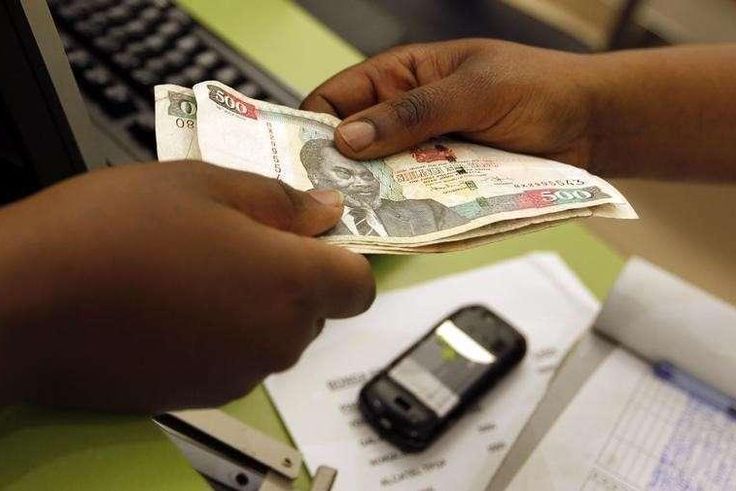 A customer hands over money to a vendor