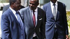 NASA luminary Raila Odinga with IEBC Chairman Wafula Chebukati (C) and CEO Ezra Chiloba during their meeting at the Capital Hill on February 8, 2017.