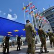 Soldiers of a Eurocorps detachment carry the EU flag in front of the European Parliament in Strasbourg, eastern France