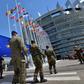 Soldiers of a Eurocorps detachment carry the EU flag in front of the European Parliament in Strasbourg, eastern France