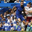 Chelsea's English defender Gary Cahill (L) vies with Burnley's Icelandic midfielder Johann Berg Gudmundsson during the English Premier League football match between Chelsea and Burnley at Stamford Bridge in London on August 12, 2017